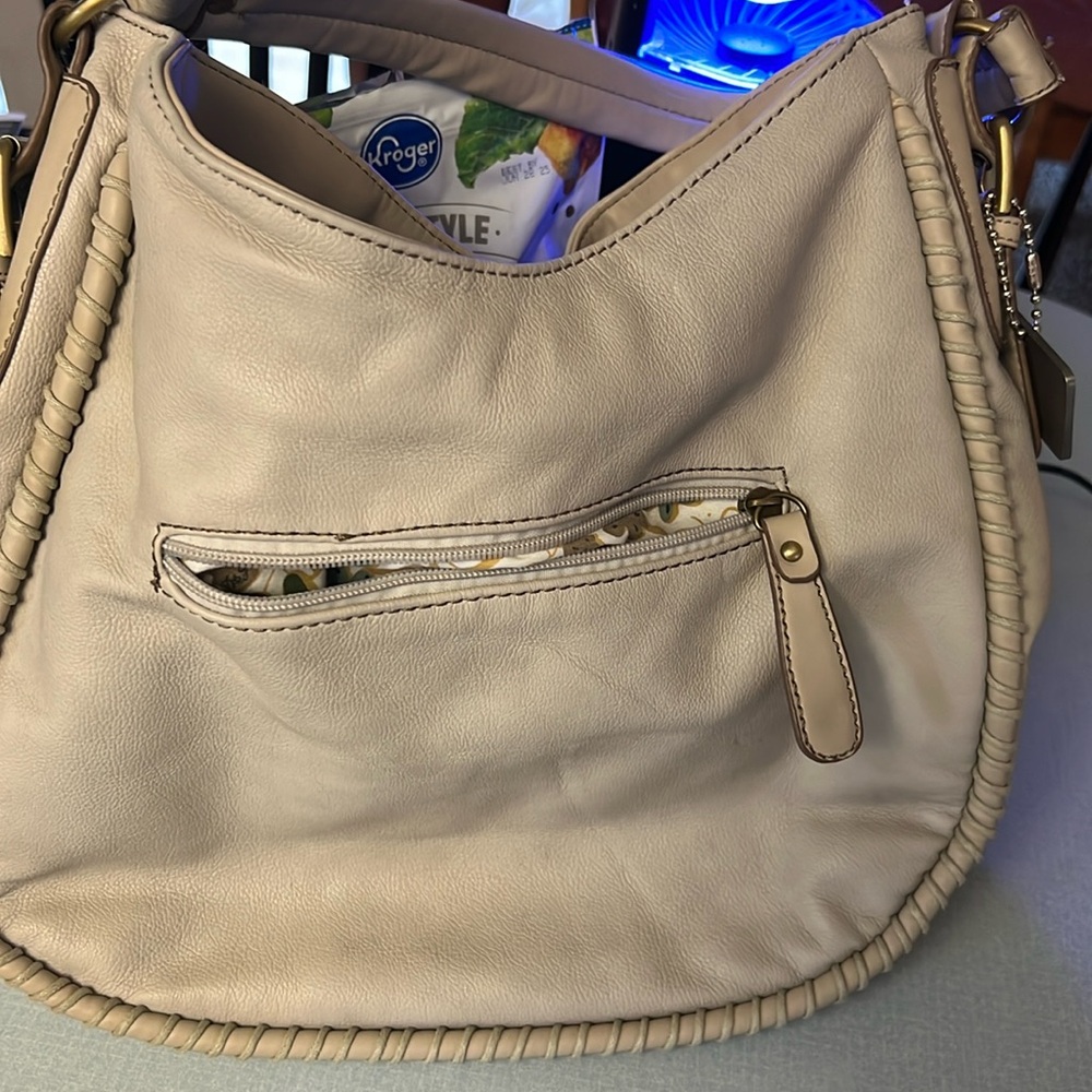 David Jones leather tan purse. Tiny flaw in back.  Roomy.